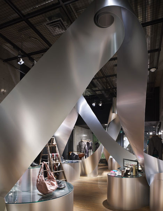 Illustration for article titled Aluminum Rolls Uncoil For An Artistic Metallic Labyrinth